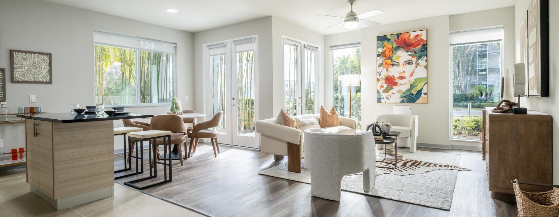 a living room with a white couch and a white table