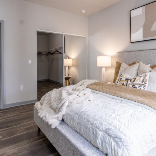 Generous bedroom offerings to fit every family a bedroom with a bed and lamps