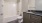 a bathroom with a tub sink and toilet