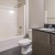 a bathroom with a tub sink and toilet