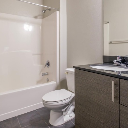 Spacious bathrooms with everything you need a bathroom with a tub sink and toilet