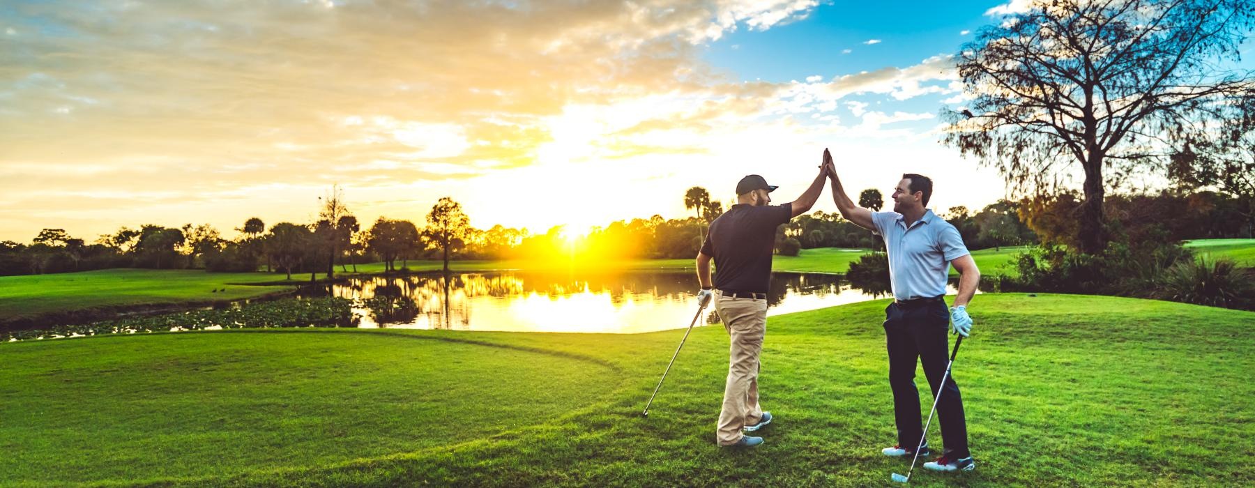 a couple of men playing golf