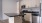 a kitchen with wooden cabinets
