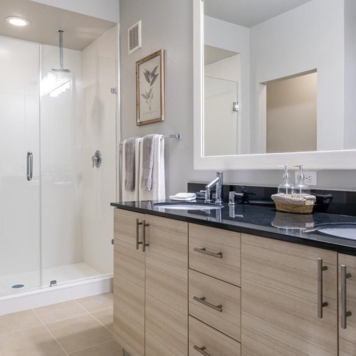 Spacious kitchens with thoughtful details a bathroom with a large mirror