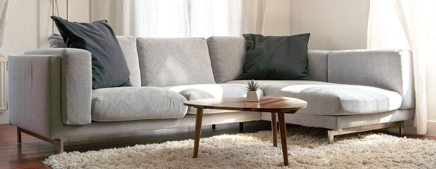 oversized windows brighten spacious, furnished living room