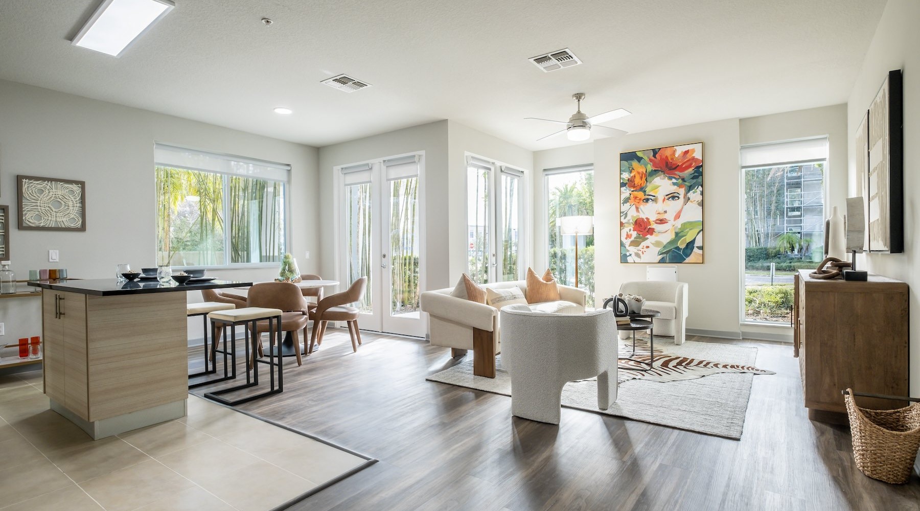 large living space with seating and windows