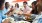 a group of people eating at a table